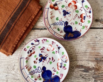 A pair of vintage Gaudy small side plates