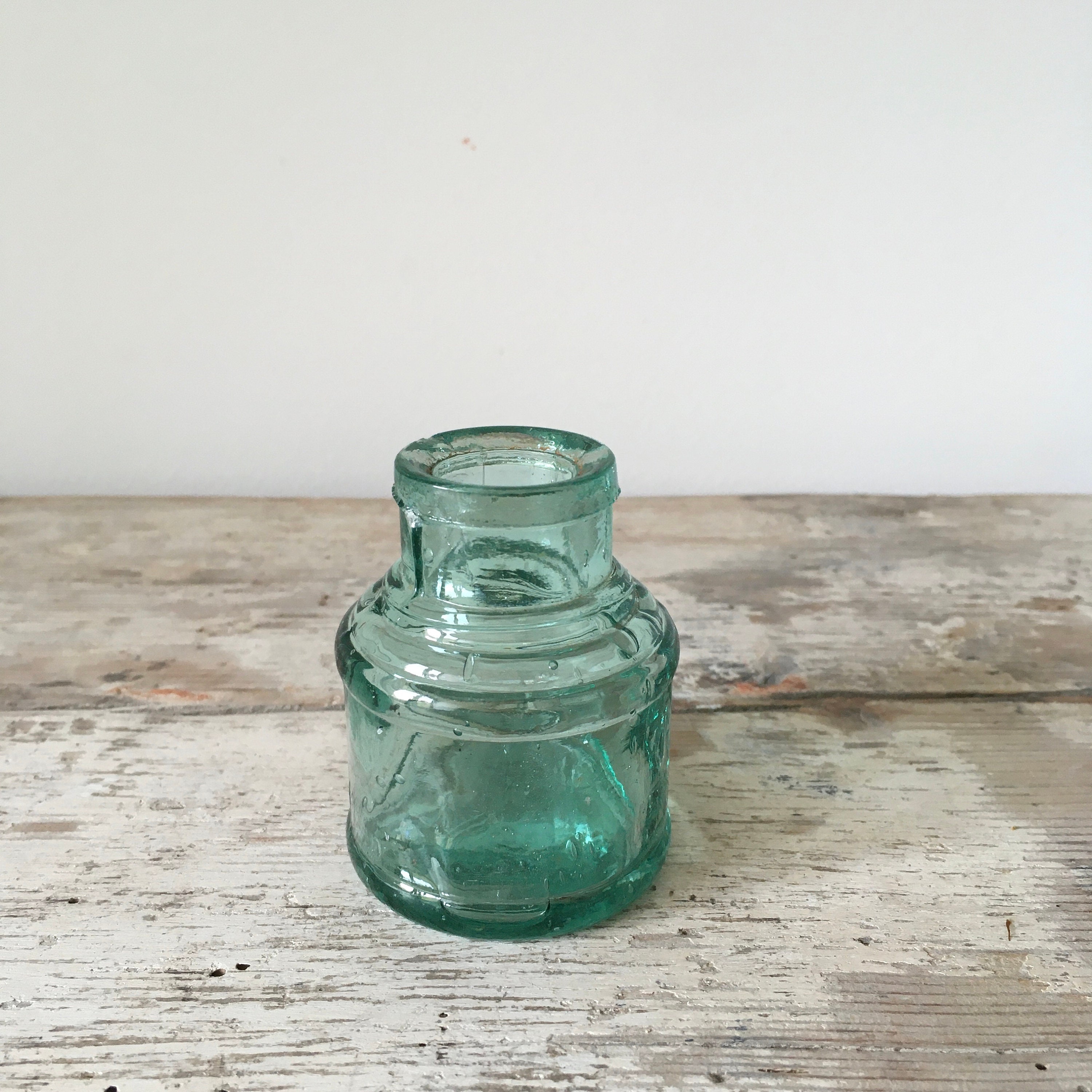 Set of 5 antique ink bottles.