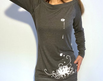 May include: A gray long-sleeved shirt with a white floral design and a white drop of paint on the front.