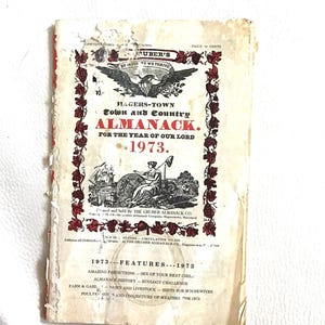 May include: A vintage 1973 Hagerstown Town and Country Almanack. The cover features a red and black design with an eagle emblem and text. The almanac includes features like predictions, history, and farming tips.