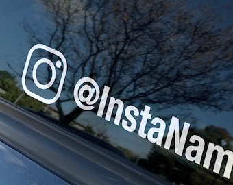 May include: White vinyl decal with an Instagram logo and the text "@InstaNameHere" for a car window.