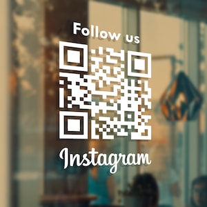 May include: A white ceramic mug with a black handle and the text "But First, Coffee" in a bold, black font. The mug is displayed on a white surface, highlighting its simple design.