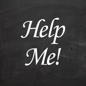 May include: A black chalkboard with the words "Help Me!" written in white chalk.