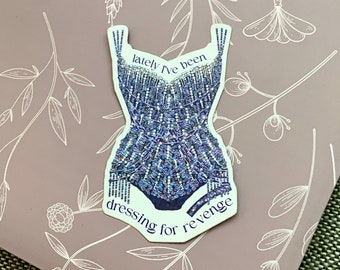 May include: A sticker with a sparkly blue bodysuit and the text "lately I've been dressing for revenge".