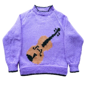 May include: Purple knitted sweater with a brown and black violin design. The sweater is double knit and has a crew neck. The text "Violin Sweater" and "Double Knitting" is printed below the image. The text "26-32 inch chest" is printed on the right side of the image. The text "designs by Linda Moorhouse" is printed below the image.