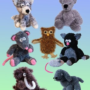 May include: A collection of seven knitted animal toys, including a wolf, bear, owl, rat, cat, mammoth, and a dog. The toys are all in various shades of gray, brown, and black. The title "Cute Toys to Knit 4" is at the top of the image. The text "designs by Linda Moorhouse" is at the bottom of the image.