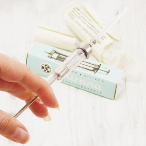 medical injection syringe needle glass tubes hospital instrument medical device doctor present nurse syringe glass farm tools hypodermic
