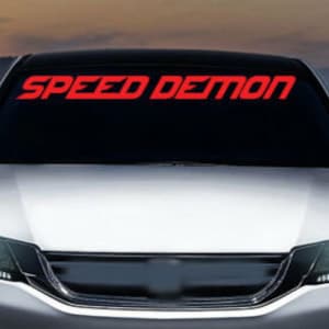 May include: A white car with a red "SPEED DEMON" decal on the windshield.