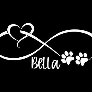 May include: White infinity symbol with a heart and two paw prints. The word "Bella" is written below the symbol.