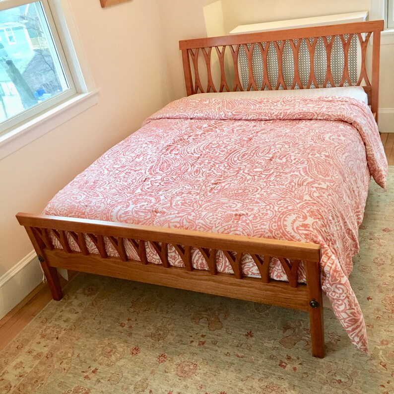 Cherry bed frame with curved carved headboard and ...