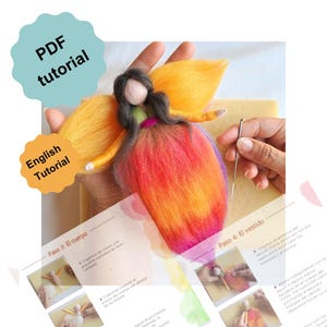 May include: A felt angel figurine with orange and red wings and a vibrant dress, being crafted with a needle. The image includes a tutorial with the text "PDF tutorial" and "English Tutorial". The angel is a handmade craft project.