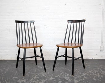 Vintage MCM pair of teak black spindle back windsor chairs by Ilmari Tapiovaara | Free delivery only in NYC and Hudson Valley areas