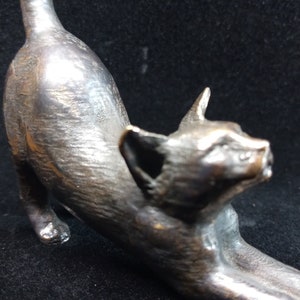 Stretching Cat Bronze Sculpture: Handcrafted Metal Art