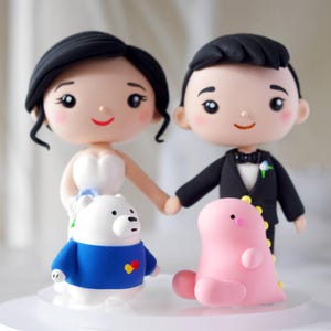 Personalisierte Hochzeitstorte mit Haustieren: Braut und Bräutigam Figurine mit Lieblingstierspielzeug