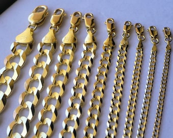 May include: A set of eight gold chains of varying lengths and widths. The chains are all made of a classic curb link style.