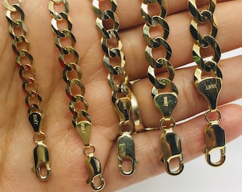 May include: Four gold chains of different lengths, each with a lobster clasp and a 10kt stamp. The chains are made of a thick, curb link design.
