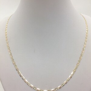 May include: A gold chain necklace with a delicate, textured design. The chain is made of 10k gold and is approximately 18 inches long.