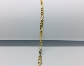 May include: A gold and silver two-tone chain bracelet with a lobster clasp.