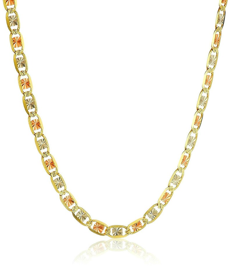 May include: A gold necklace with a distinctive design. The chain features alternating oval links with a textured, starburst pattern in yellow, rose, and white gold. The necklace is displayed against a white background.