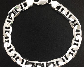 May include: A silver mariner chain bracelet with a lobster clasp.