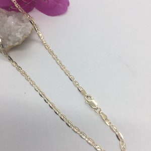 May include: A gold chain necklace with a delicate, textured design. The chain is approximately 18 inches long and has a lobster claw clasp.