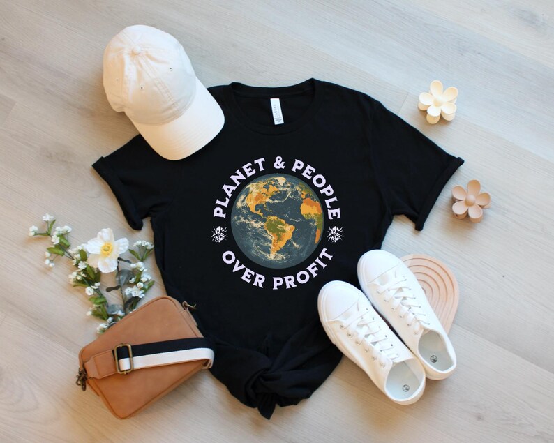 May include: Black t-shirt with a graphic of a globe and the text "Planet & People Over Profit".