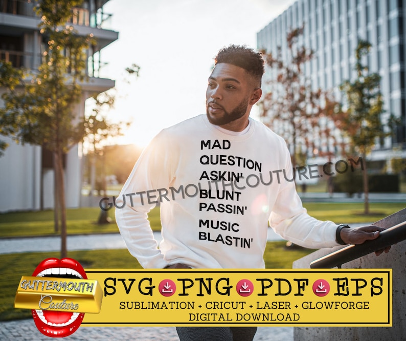 May include: A white long-sleeve shirt with black text that reads "MAD QUESTION ASKIN' BLUNT PASSIN' MUSIC BLASTIN'". The shirt is worn by a person standing in front of a building.