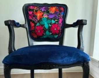 Color with a Mexican vibe! Bright, fun chair with Mexican embroidered fabric. Unique artisan fabric with a black frame to accentuate colors.