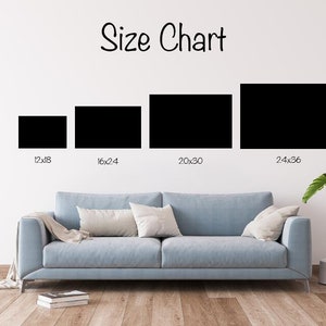 May include: Size chart for canvas prints showing four different sizes: 12x18 inches, 16x24 inches, 20x30 inches, and 24x36 inches. The chart is displayed on a white wall with a light blue sofa in the foreground.