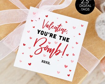 May include: White printable gift tag with red hearts and the text "Valentine, You're the Bomb! xoxo."