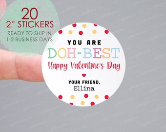 May include: A set of 20, 2-inch round stickers with a white background and colourful polka dots. The stickers say "You are DOH-BEST Happy Valentine's Day" with a red heart and "Your Friend, Ellina".