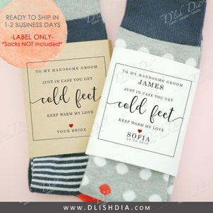 May include: Two pairs of socks with labels. One label reads "To My Handsome Groom" and "Just in case you get cold feet." The other label reads "To My Handsome Groom James" and "Just in case you get cold feet." The socks have gray, white, and blue patterns.