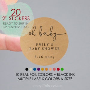 May include: Twenty 2-inch round kraft paper stickers with the text "oh baby" in a script font, "Emily's Baby Shower" and the date "8.26.2024". The stickers are available in ten real foil colors and black ink.