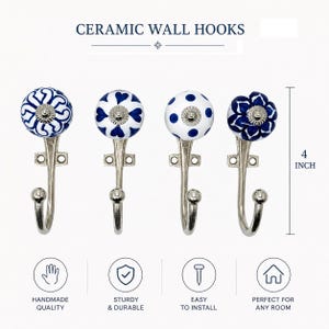 May include: Four ceramic wall hooks with blue and white patterns. The hooks are approximately 10 cm tall and have a silver metal base. The text "CERAMIC WALL HOOKS" is at the top of the image.