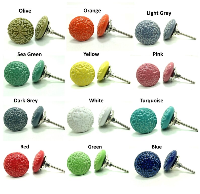 May include: A collection of twelve round ceramic cabinet knobs, each featuring an embossed floral pattern. The knobs are displayed in various colors including olive, orange, light grey, sea green, yellow, pink, dark grey, white, turquoise, red, green, and blue, each with a silver-toned metal bolt.