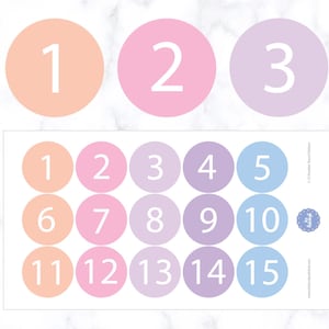 May include: A printable sheet of 15 colorful circles with numbers 1 through 15. The circles are in shades of pink, purple, and blue.