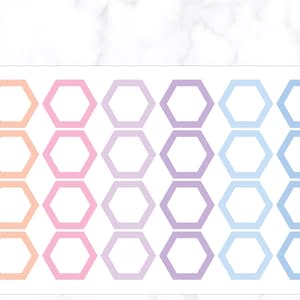 May include: A sheet of stickers with a repeating pattern of pastel-coloured, open-centre hexagons. The colours transition from peach to pink, lavender, and light blue. The stickers are arranged in rows and columns.