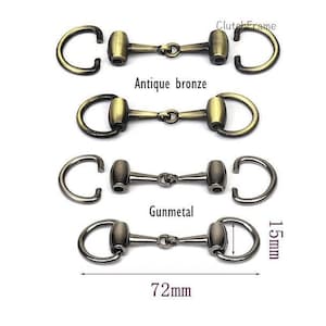 May include: Three sets of antique bronze and gunmetal horse bit snaffle rings. The rings are 72 mm long and 15 mm wide. The rings are a popular choice for jewelry making and crafting.
