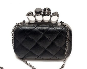 purse with brass knuckle handle