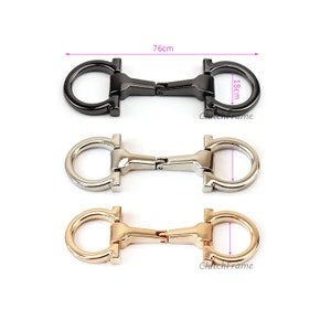 May include: Three metal clasps in black, silver, and gold. Each clasp is 1.8 inches in diameter and 7.6 inches long.