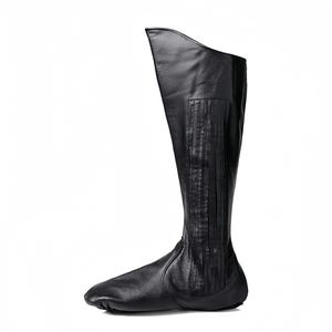 A single black leather boot with a pointed toe and a high heel.