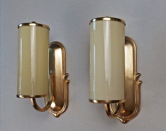 Beautiful pair of 1940s art deco brass sconces with beige opaline glass shades