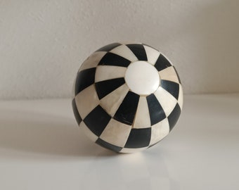 Decorative ball with bone (1920)