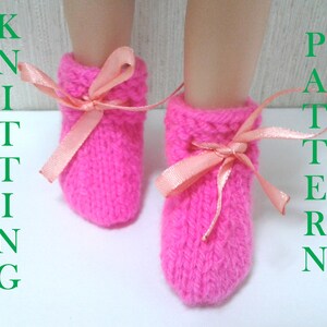 May include: Pink knitted baby booties with peach satin ribbon ties.  Knitting pattern.