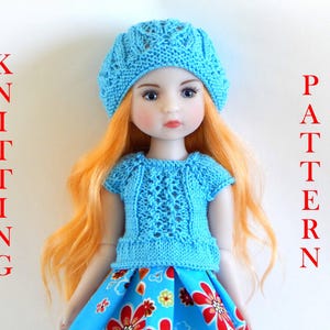May include: A doll wearing a blue knitted hat and a blue knitted top with a floral skirt. The doll has long, orange hair and blue eyes. The image is labelled "Knitting Pattern".