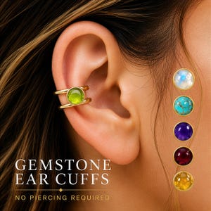 May include: Gold-toned gemstone ear cuffs with a green gemstone are shown on an ear. Additional gemstones in blue, purple, and yellow are displayed. The text reads "GEMSTONE EAR CUFFS" and "NO PIERCING REQUIRED."