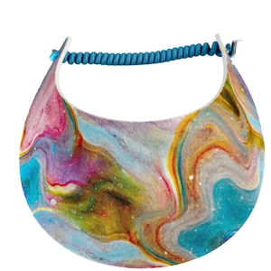 May include: A colorful visor with a swirling abstract design in shades of blue, pink, yellow, and white. The visor has a curved brim and a blue cord for securing it to the head. This accessory is perfect for sun protection.