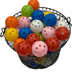 May include: A black wire basket filled with colorful plastic balls with holes. The balls are in various colors, including red, orange, yellow, green, blue, pink, and white.