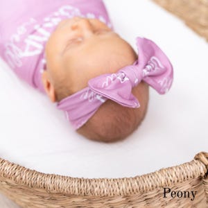 Custom name baby swaddle and matching blanket designed for newborn photo sessions, hospital swaddle photos, and announcement pictures. A timeless personalized baby gift and keepsake perfect for neutral nurseries and modern parents.