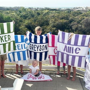 May include: A handmade wooden sign with the text "Welcome to our home" in a handwritten style. The sign is painted white with black lettering and a distressed finish, suitable for indoor or outdoor use.